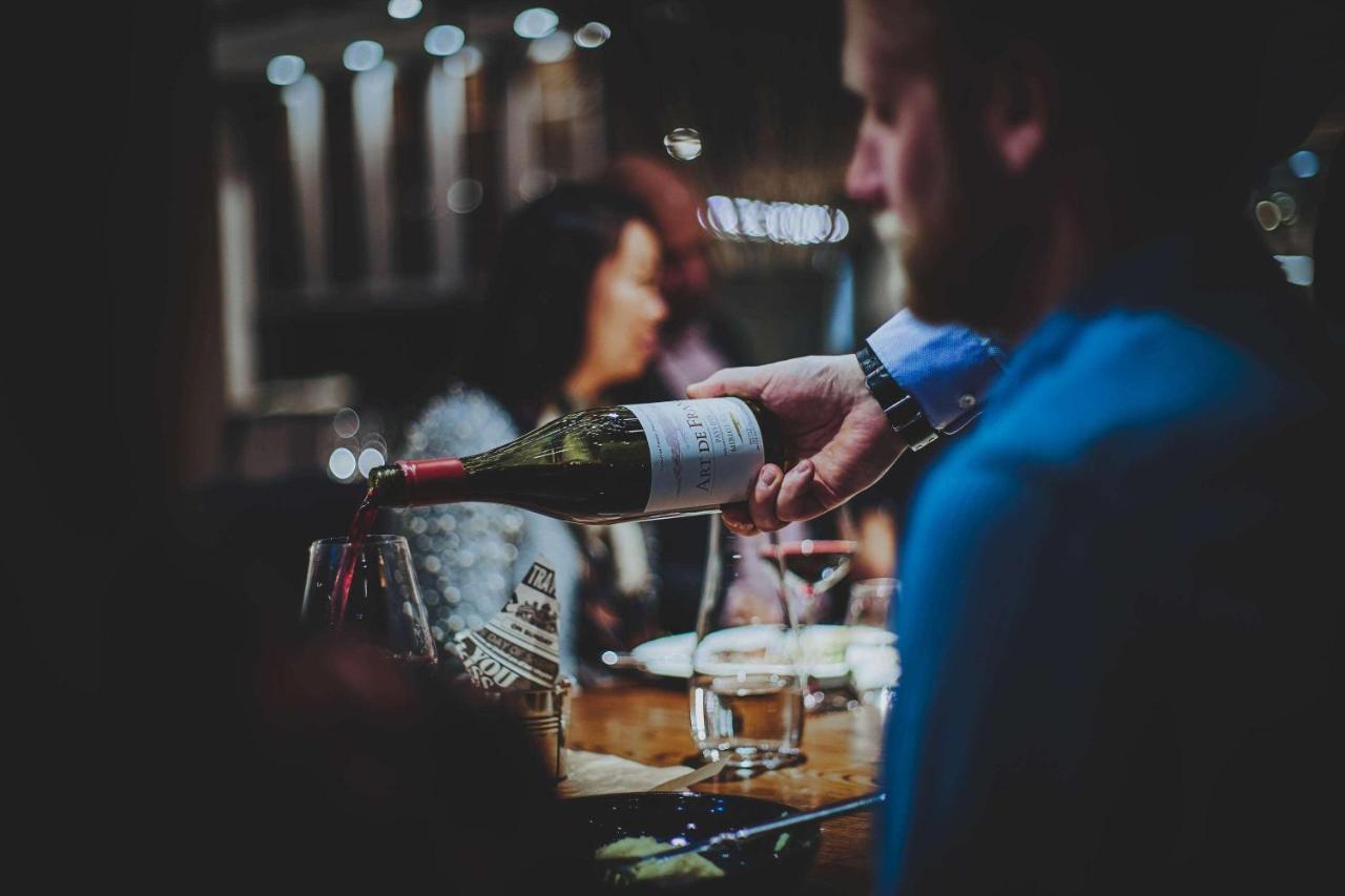 Radisson Collection, Strand Hotel, Stockholm Bagian luar foto Wine being poured at a wine bar